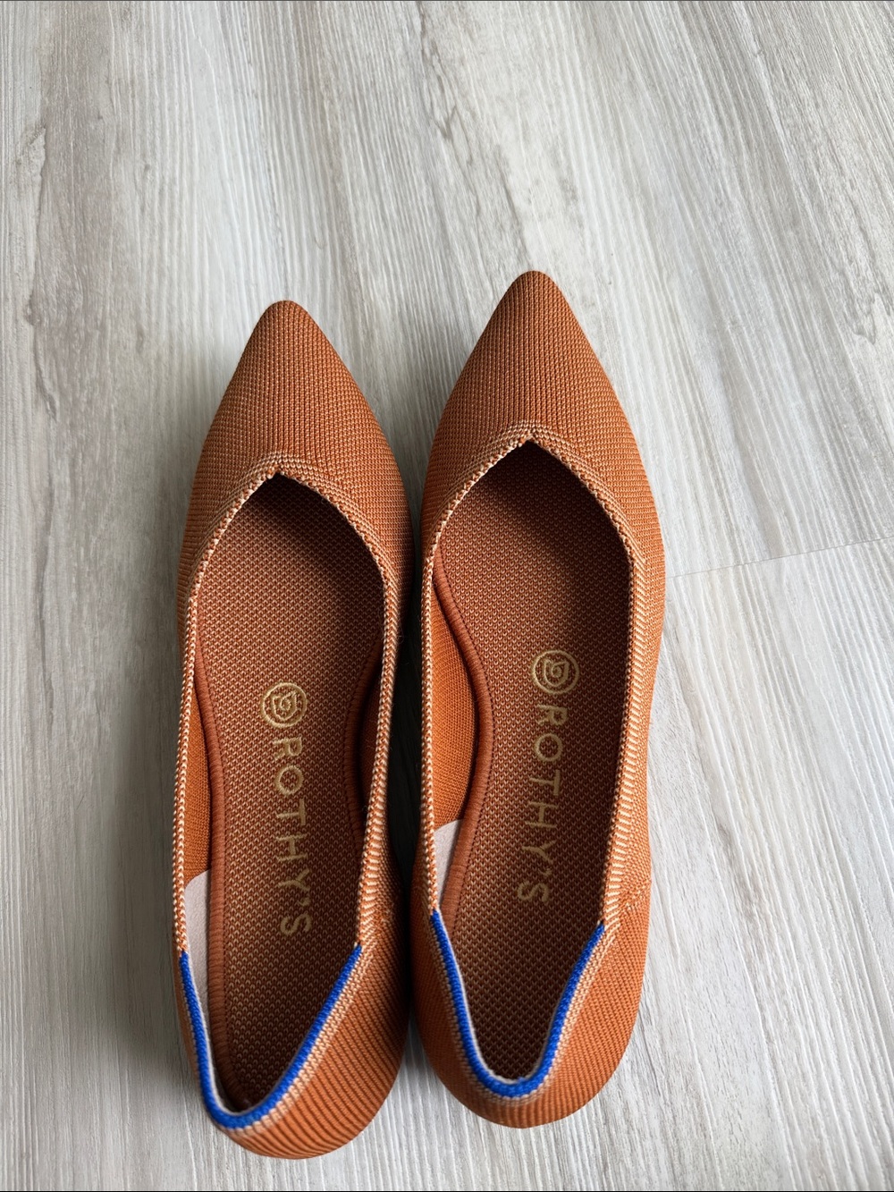 Rothy's Pointed Knit Flats in Rust with Blue Accent